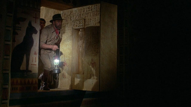 Blood From the Mummy's Tomb - explorer entering tomb with cat shadow on wall