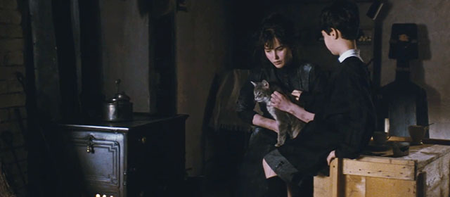 Camille Claudel - boy Robert Martin Berléand handing gray cat to Camille Isabelle Adjani