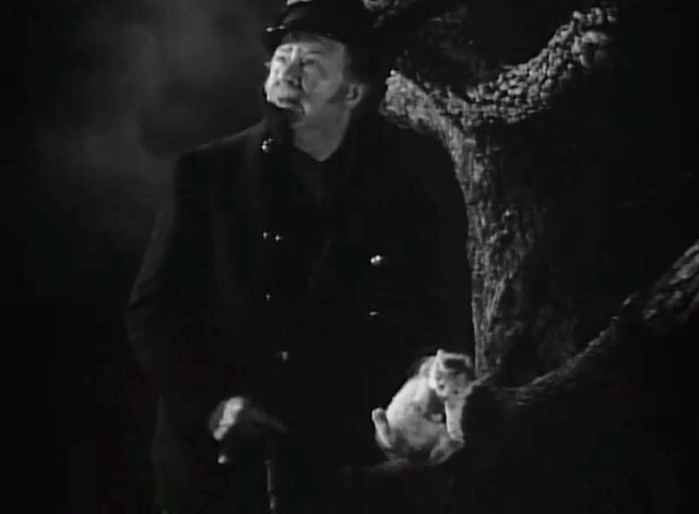 The Captain is a Lady - Captain Abe Peabody Charles Coburn holding calico kitten on dark night as it starts to rain