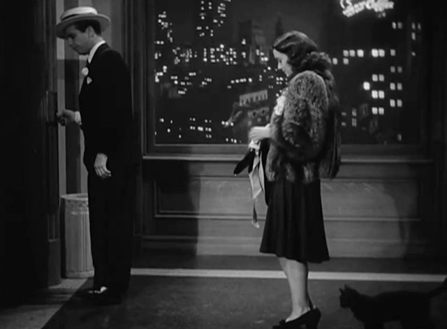 Christmas in July - black cat Hamlet in hallway with Jimmy Dick Powell and Betty Ellen Drew