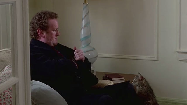 Claire Dolan - Cain Colm Meaney with longhair tabby cat approaching