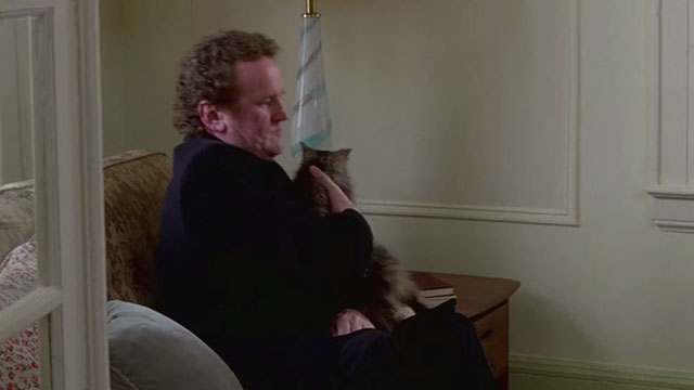 Claire Dolan - Cain Colm Meaney picking up longhair tabby cat