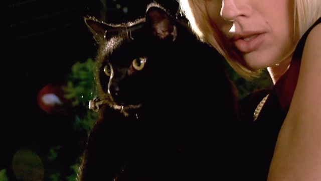 The Dog Who Saved Halloween - Monique Kristen Miller holding black cat Rufus Inky