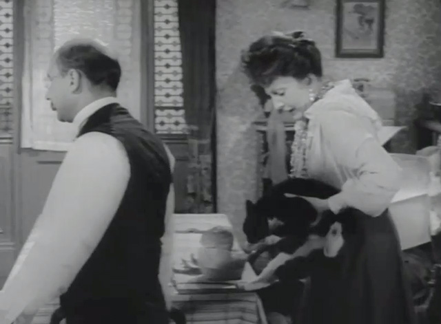 Dr. Crippen - Crippen Donald Pleasance walking away as wife Belle Coral Browne picks up tuxedo cat