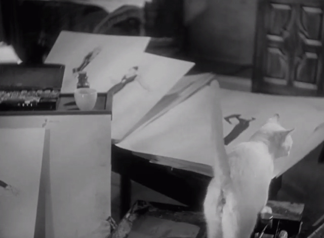 Fashions of 1934 - white cat climbing onto drawing table