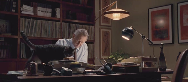 Frankie and Alice - tabby cat Sigmund on desk with Dr. Oz Stellan Skarsgård