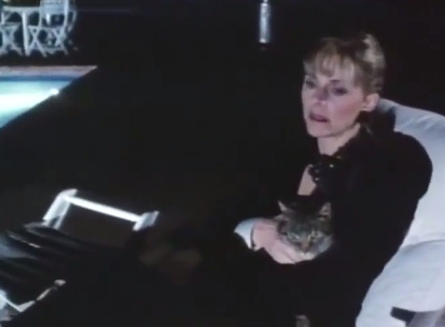 From the Dead of Night - Joanne Lindsay Wagner holding tabby cat on lounge chair