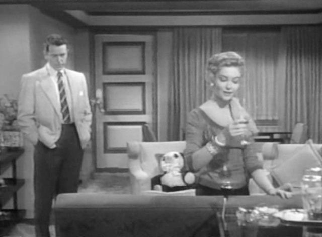 The Glass Web - Paula Kathleen Hughes and Don John Forsythe with stuffed panda on chair in background