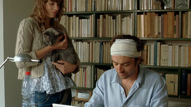 Le Grand Alibi - blue gray cat held by Marthe Céline Sallette with Philippe Mathieu Demy