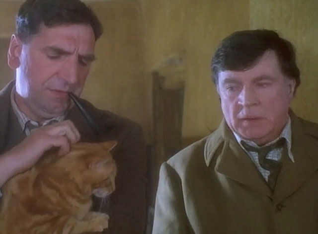 Grotesque - George Jim Carter holding ginger tabby cat with Sir Hugo Coal Alan Bates