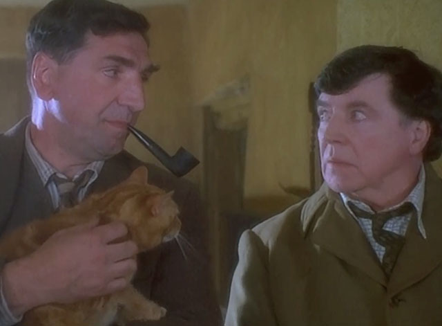 Grotesque - George Jim Carter holding ginger tabby cat with Sir Hugo Coal Alan Bates