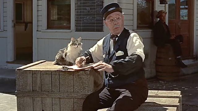 Guns of the Timberland - Bill Burroughs Paul E. Burns with longhair tabby and white cat beside him