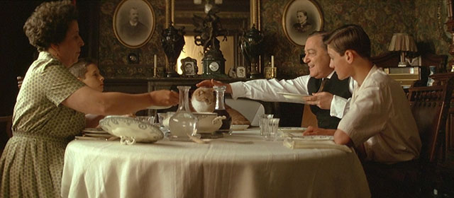 The Hairdresser's Husband - ginger and white tabby cat sitting on dinner table with Antoine Henry Hocking, Yveline Ailhaud, Roland Berton and Christophe Hémon