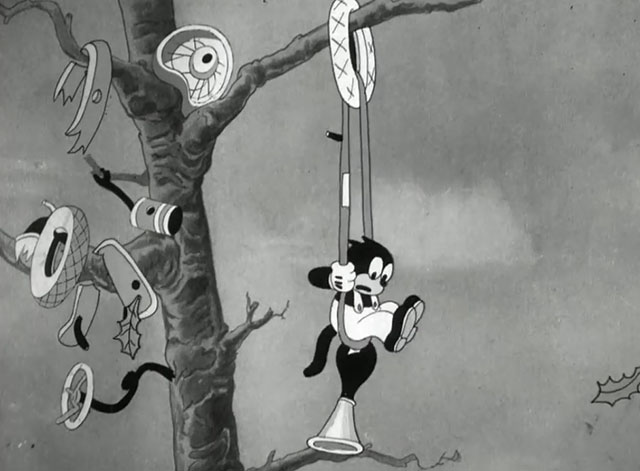 Hollywood Capers - Looney Tunes cartoon black cat Beans hanging from tree with car parts