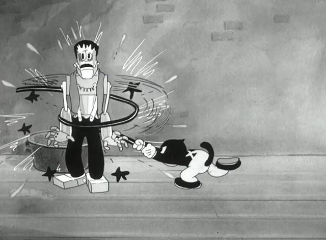 Hollywood Capers - Looney Tunes cartoon black cat Beans wrapping steel pole around Frankenstein's monster