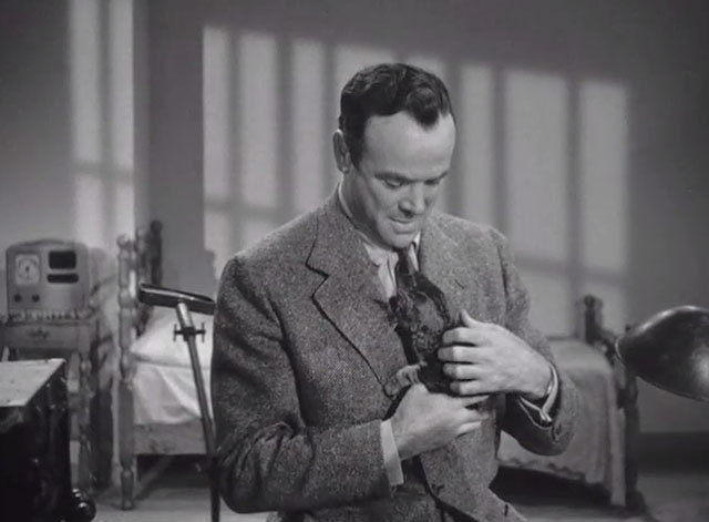 I Escaped from the Gestapo - Torgut Lane Dean Jagger holding tabby kitten Pal