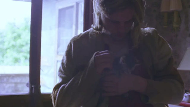 Last Days - Blake Michael Pitt holding tabby kitten