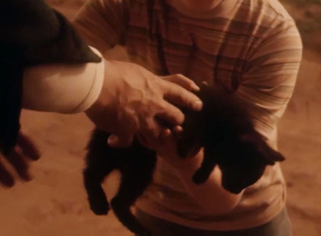 The Last Ninja - black kitten being handed to Kenjiro