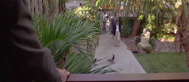 License to Kill - James Bond Timothy Dalton entering Hemmingway House with cats