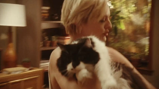 Listen Up Philip - Ashley Elisabeth Moss dancing with longhair tuxedo cat Gadzookey Fluffy