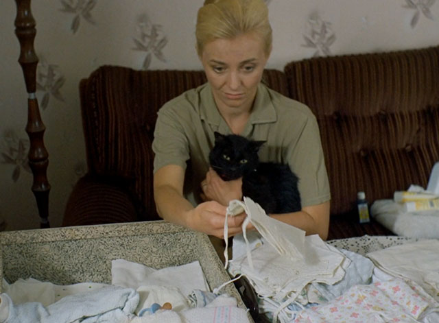 Little Otik - black cat Mikeš held by Bozena Veronika Zilková