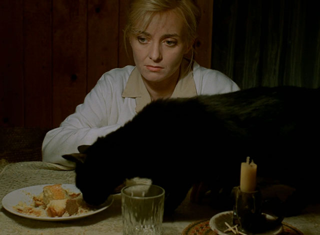 Little Otik - black cat Mikeš eating from dish with Bozena Veronika Zilková