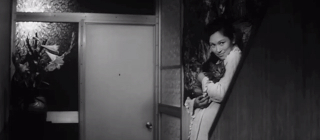 The Living Skeleton - Sanae Keiko Yanagawa holding tabby cat