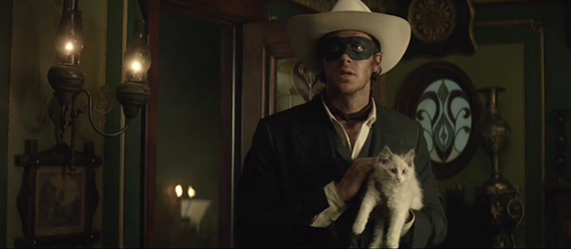 The Lone Ranger - Lone Ranger Armie Hammer holding longhair kitten