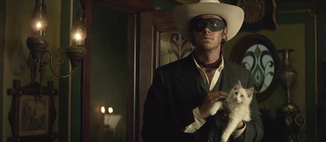 The Lone Ranger - Lone Ranger Armie Hammer holding longhair kitten