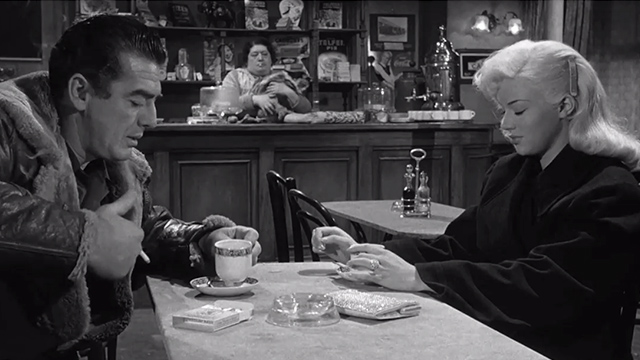 The Long Haul - Harry Victor Mature and Lynn Diana Dors sitting at table with woman and large calico cat behind counter in background