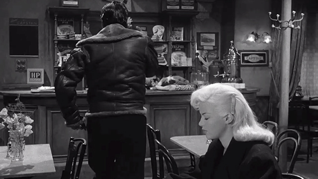 The Long Haul - Harry Victor Mature and Lynn Diana Dors sitting at table with woman and large calico cat behind counter in background