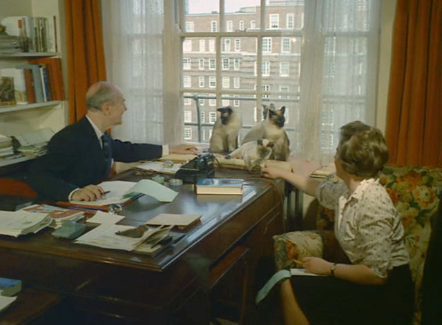 Look at Life - The Price of Valour - four Siamese cats Pooni, Tomkin, Blue Magnolia and Blue Leander sitting on windowsill by the desk of Brigadier Sir John G. Smyth with his wife