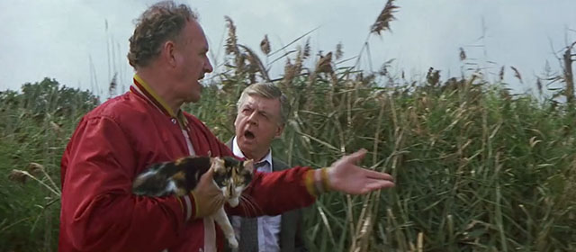 Loose Cannons - Mac Gene Hackman in swamp carrying calico cat Camus with Captain Dick O'Neill