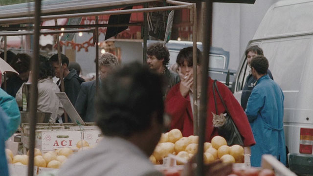 The Lovers on the Bridge - Les Amants du Pont-Neuf - Michele Juliette Binoche approaching fruit stand with Abyssinian cat Louisiana