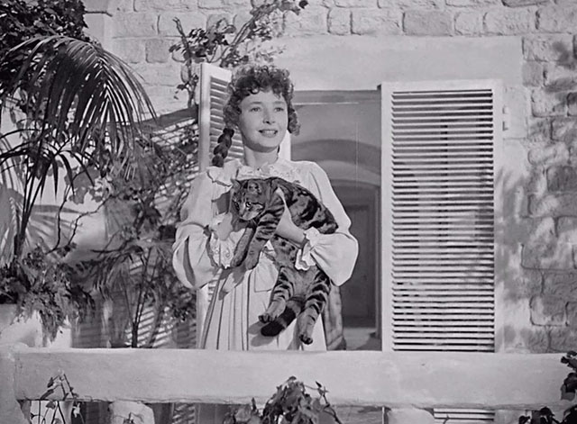 A Man About the House - Ellen Dulcie Grey holding tabby cat Waify on veranda