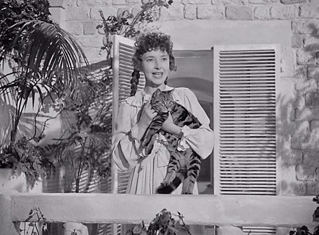 A Man About the House - Ellen Dulcie Grey holding tabby cat Waify om veranda