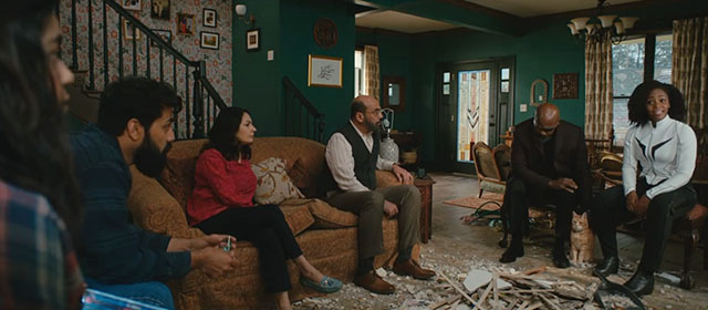 The Marvels - ginger tabby cat Flerken Goose with Kamala Iman Vellani family, Monica Teyonah Parris and Nick Fury Samuel L. Jackson