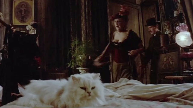 The Missionary - white Persian cat Tiddles sitting on bed as Ada Tricia George and Fortescue Michael Palin enter