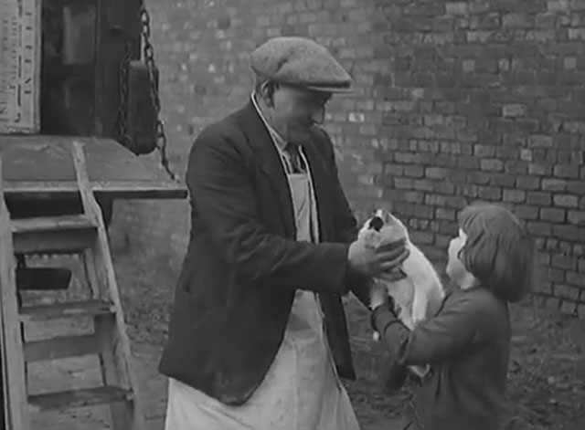 Moving a Farm - little girl handing white and black cat to moving man