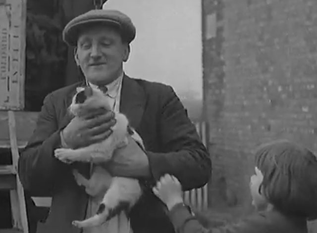 Moving a Farm - little girl with moving man holding her white and black cat by neck