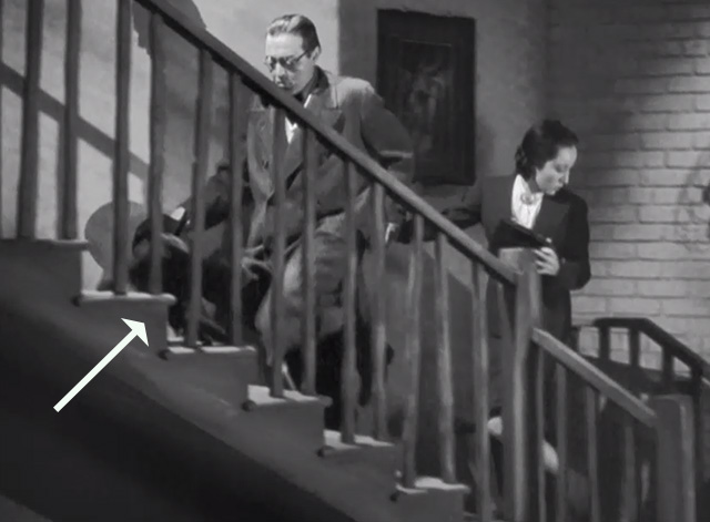 Mysterious Mr. Moto - black cat doubling back on stairs past Mr. Moto Peter Lorre and Lotus Lui Long