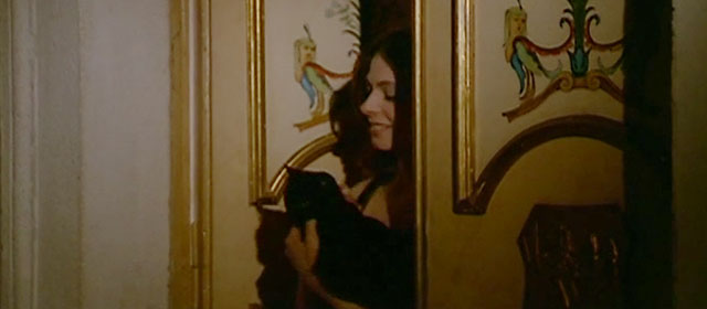 Nuda per Satana - Nude for Satan - Susan Rita Calderoni holding longhair black cat outside door