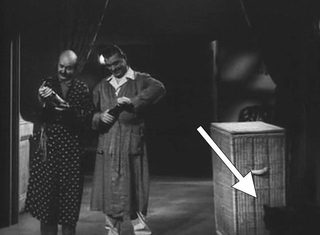 One Body Too Many - black cat sitting on table in hallway by laundry basket with Jim Lyle Talbot and Kenneth Lucien Littlefield