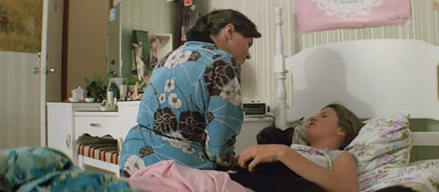 Puberty Blues - Debbie Nell Schofield lying on bed with black cat and mother Kirrily Nolan