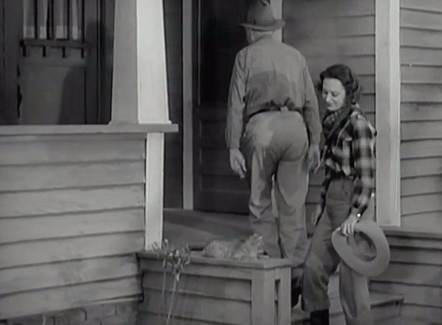 Racing Lady - tabby cat sitting outside house as Ruth Ann Dvorak and Tom Harry Carey enter