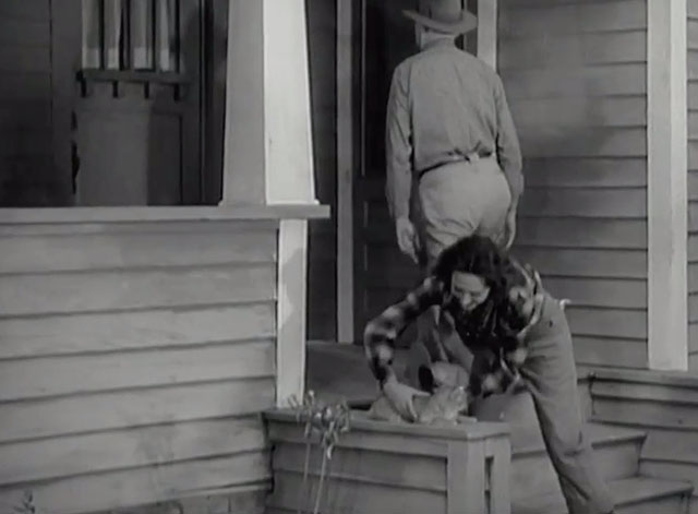 Racing Lady - Ruth Ann Dvorak picking up tabby cat as Tom Harry Carey enters house