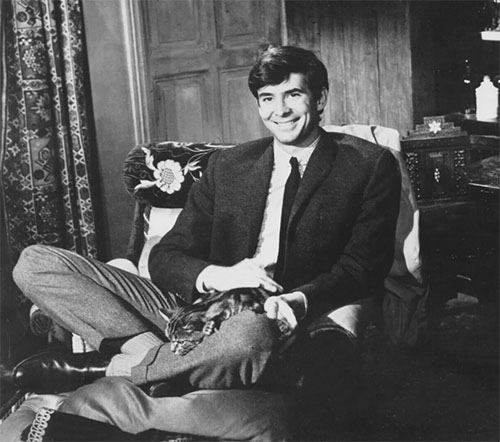 A Ravishing Idiot - Agent 38-24-36 - publicity photo of Harry Anthony Perkins sitting with tabby cat Kemal on his lap