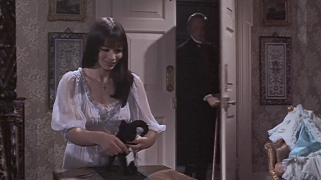 The Reptile - Dr. Franklyn Noel Willman enters room to find daughter Anna Jacqueline Pearce tying note around black kitten Katie's neck