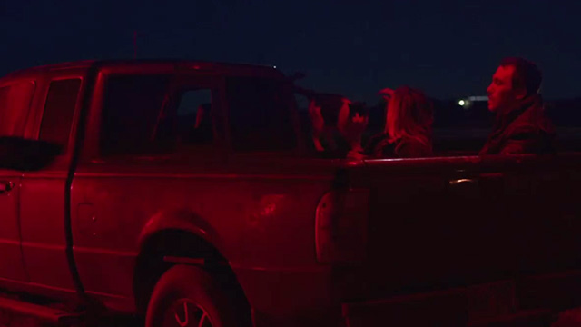 The Rider - Brady Blackburn Jandreau and Terri Dawn Pourier with tuxedo cat on pickup truck