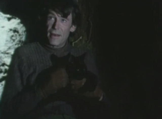 Rogue Male - Robert Hunter Peter O'Toole holding black cat Asmodeus in underground shelter